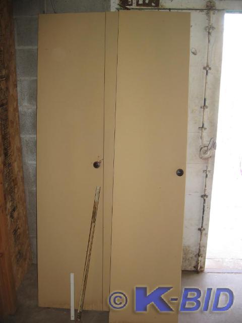 lot 24 image: 2 Bi fold closet doors with track. ...