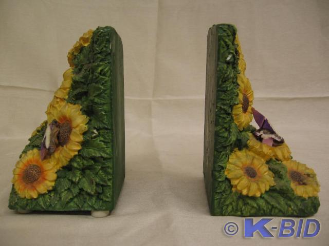 lot 59 image: Daisy bookends. Top of one is chipp...