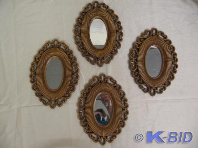 lot 78 image: Set of four oval mirrors with scrol...