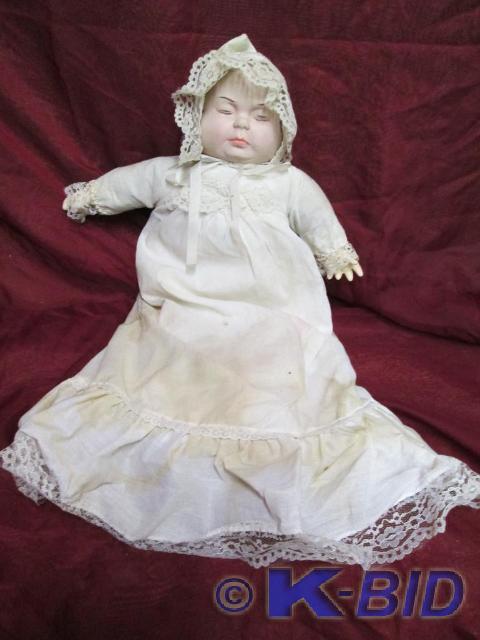 lot 182 image: Vintage porcelain doll with three s...