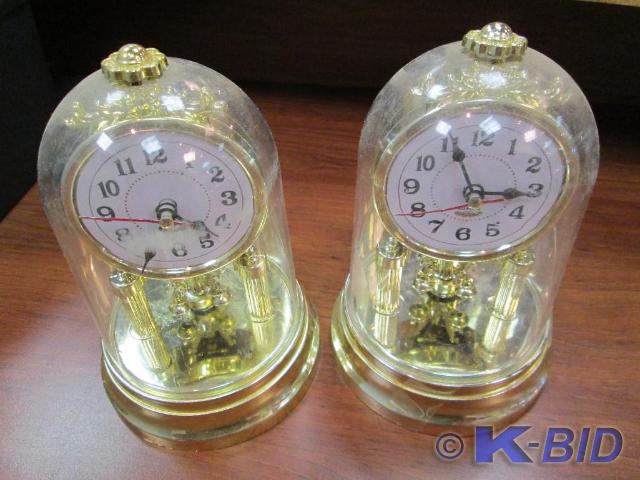 lot 24 image: Nice pair of encased mantle clocks....