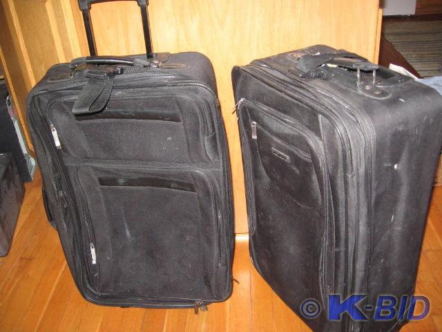 lot 323 image: Paur of luggage by Protg---one hand...