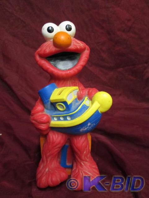 lot 105 image: Elmo coin bank. Great condition