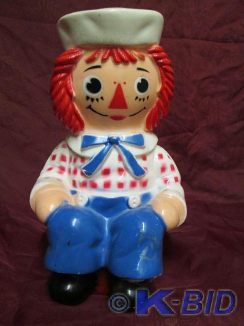 lot 112 image: Vintage Ragedy Andy coin bank. Perf...