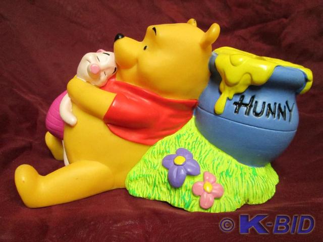 lot 115 image: Winnie Pooh and Piglet coin bank. C...