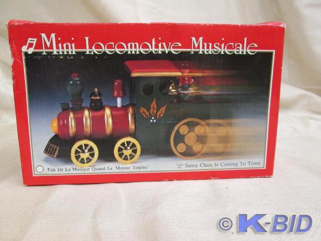 lot 154 image: Miniature musical locomotive. Mint ...