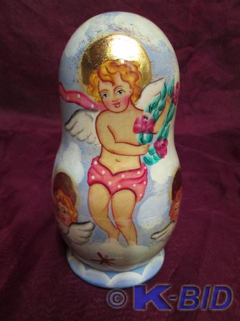 lot 23 image: German stack dolls with angel dcor....