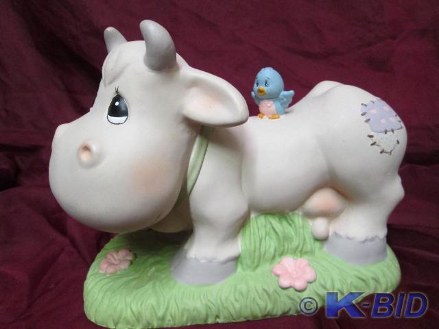 lot 61 image: Precious Moments cow with a bird. F...