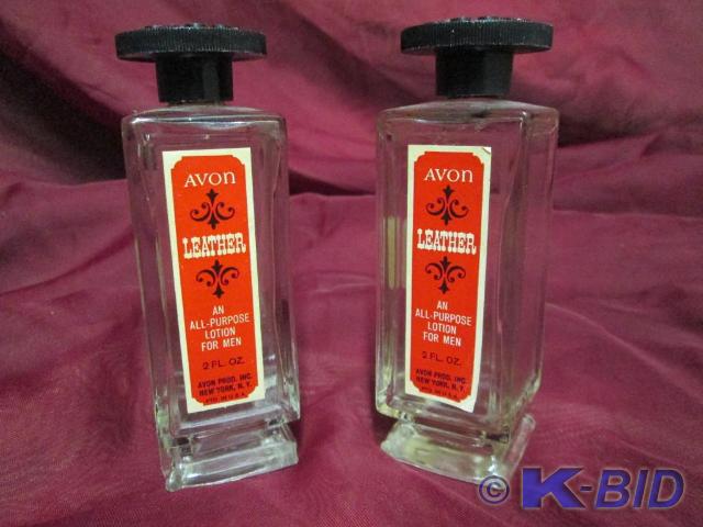 lot 79 image: Vintage Avon Leather bottles.