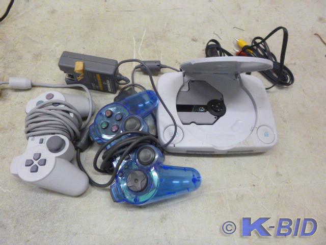 lot 68 image: PS1 and 2 Controllers and Cords   D...