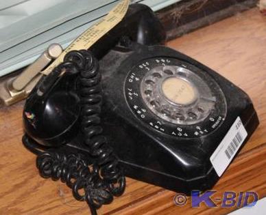 lot 110 image: Vintage black rotary telephone.