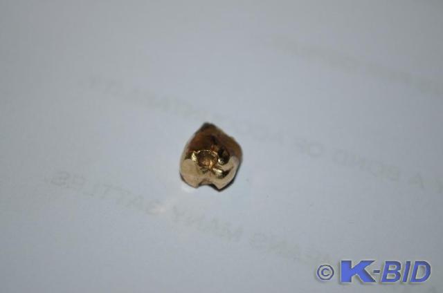 lot 45 image: GOLD Nugget from tooth- pretty heav...