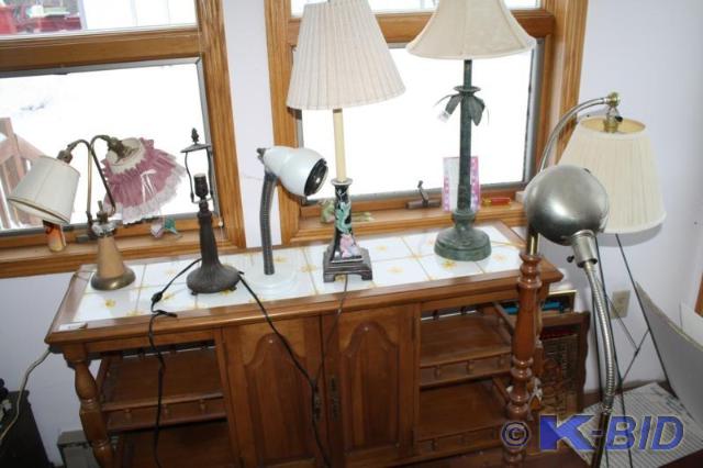lot 67 image: Group of 7 lamps. One lamp is metal...